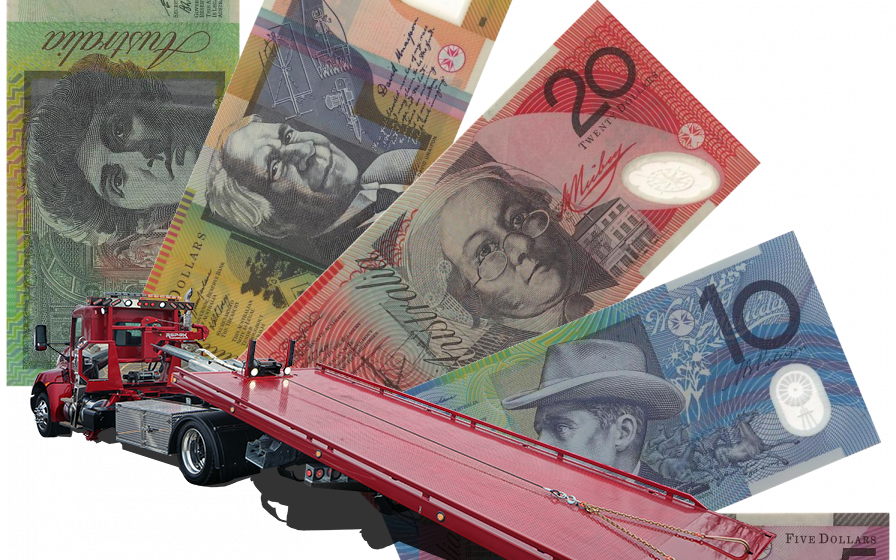 Tilt tray truck with money behind it, giving service in other areas